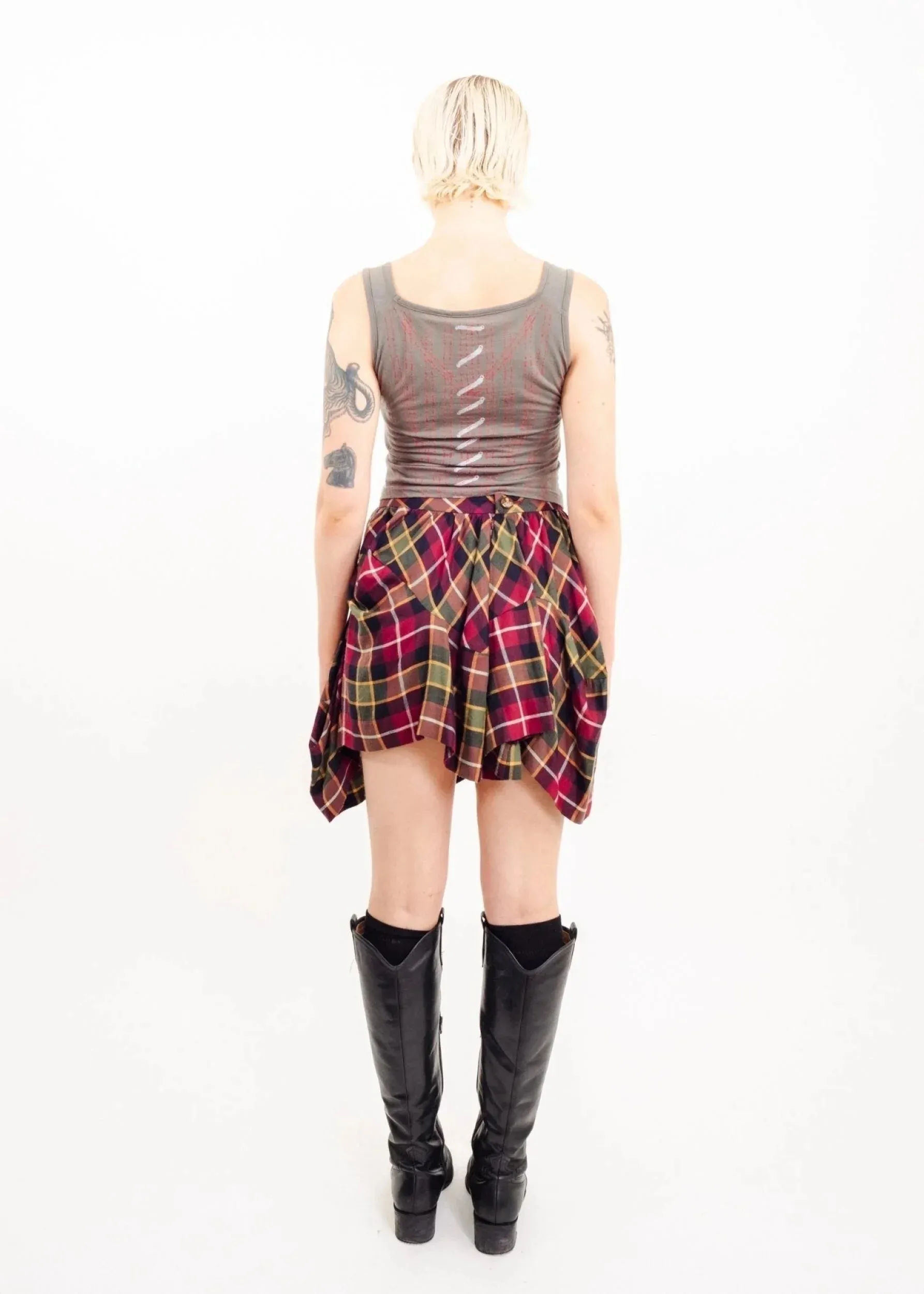 Asymmetric draped tartan skirt