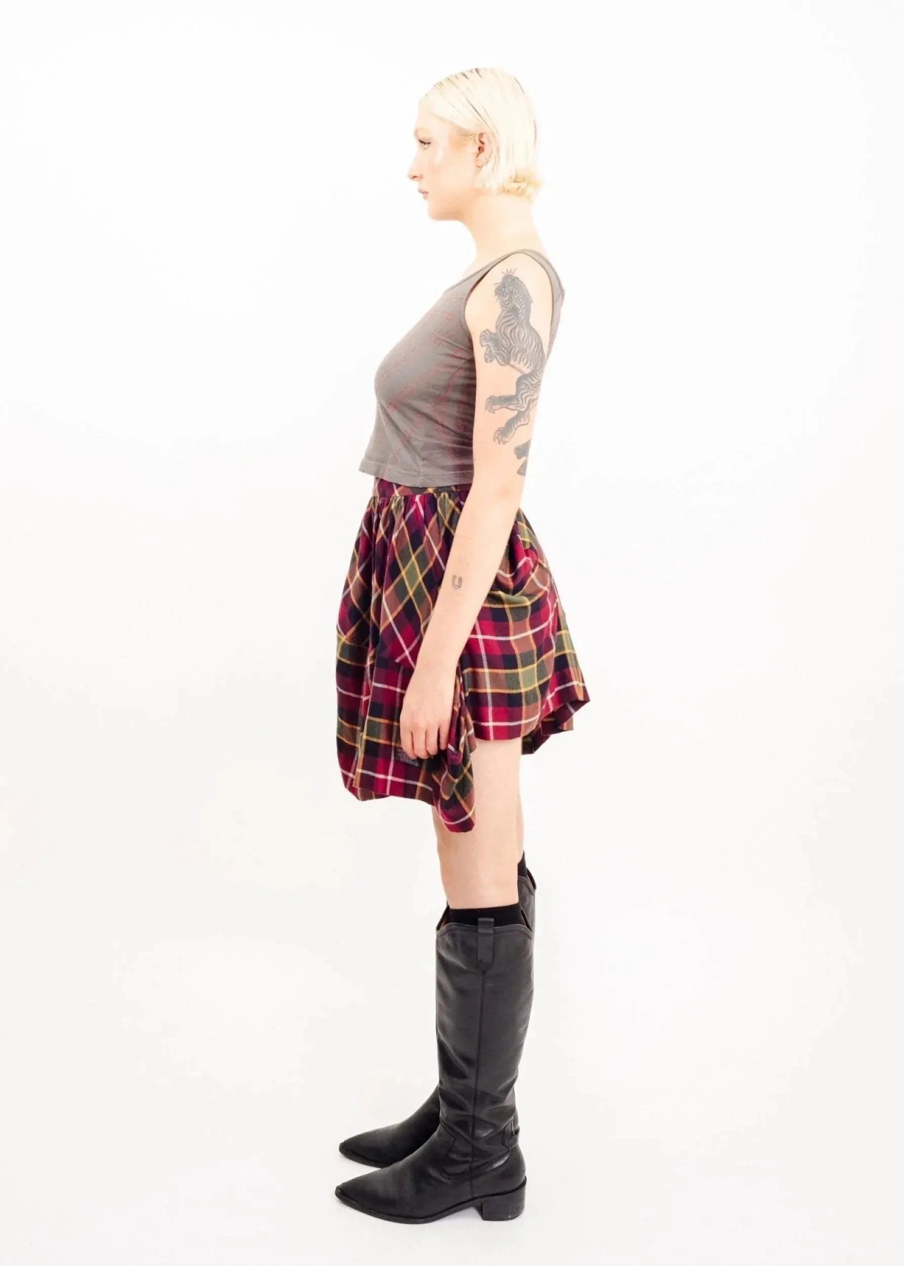 Asymmetric draped tartan skirt