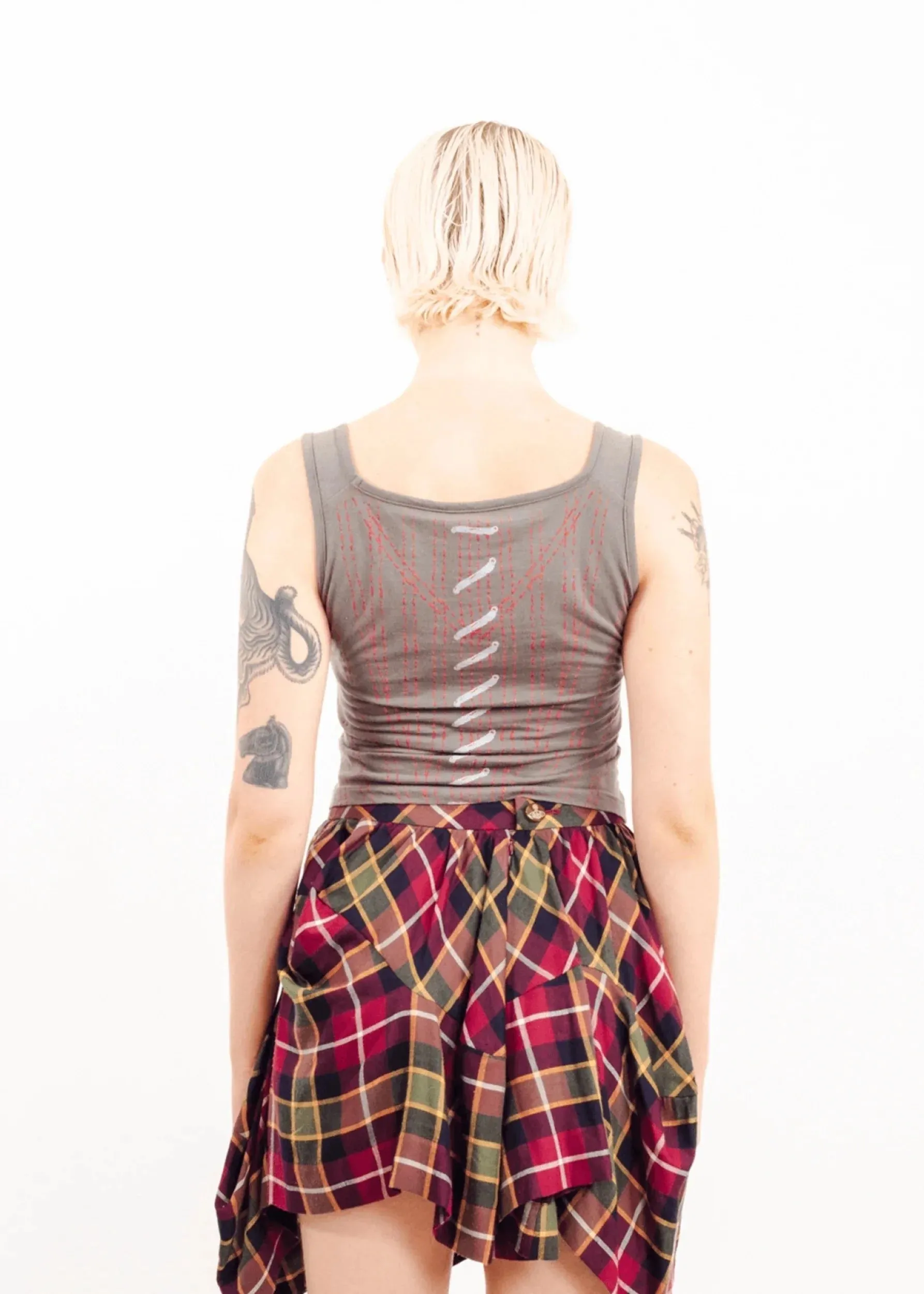Asymmetric draped tartan skirt