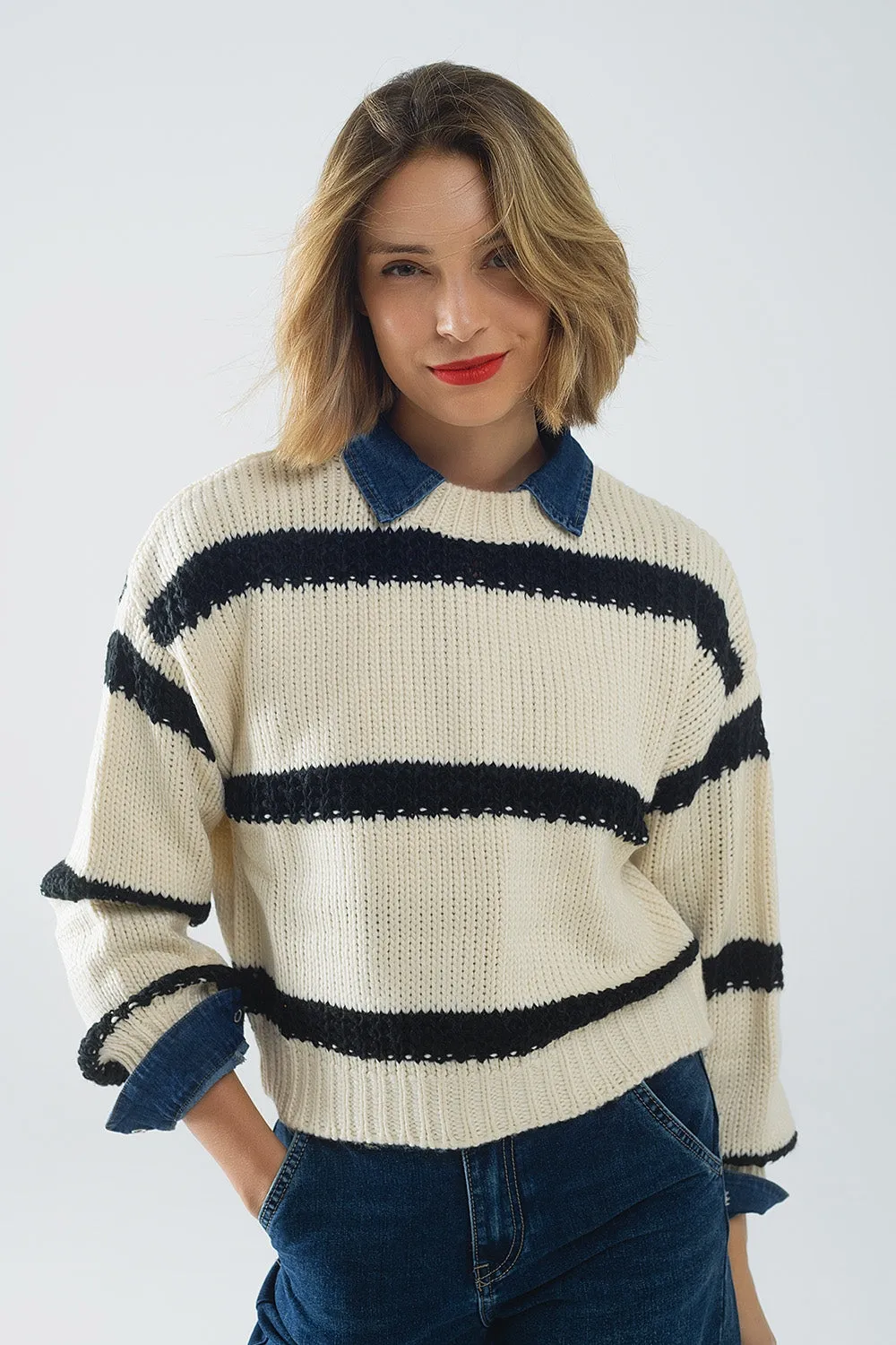 Relaxed beige jumper with black stripes