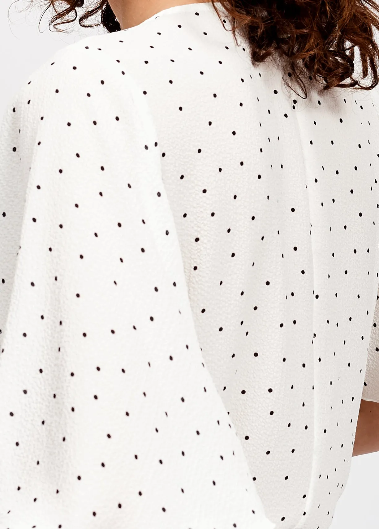 White polka dot v-neck top