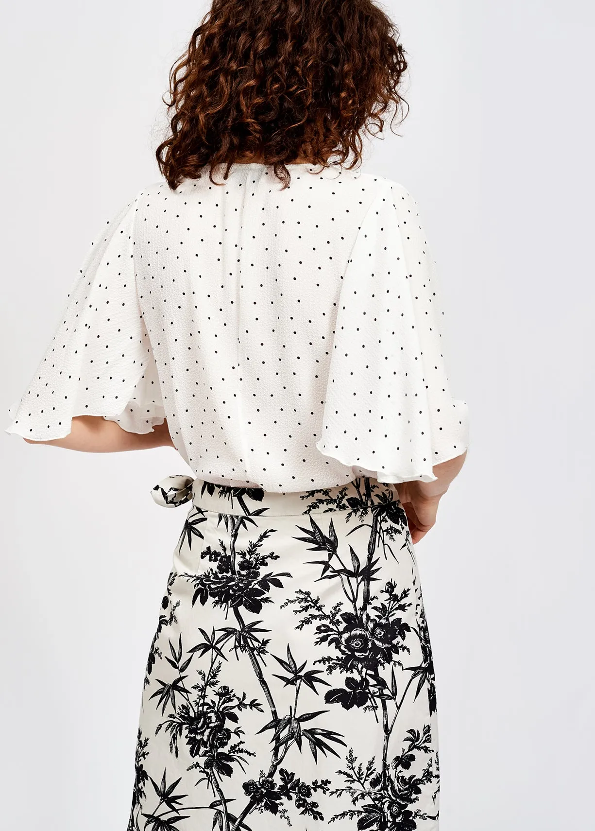 White polka dot v-neck top