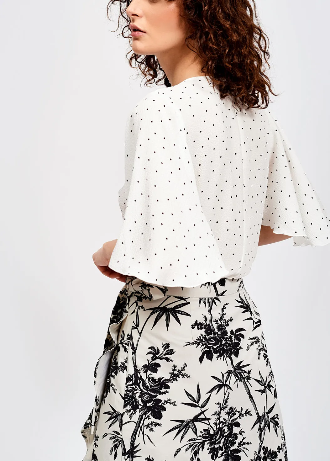 White polka dot v-neck top