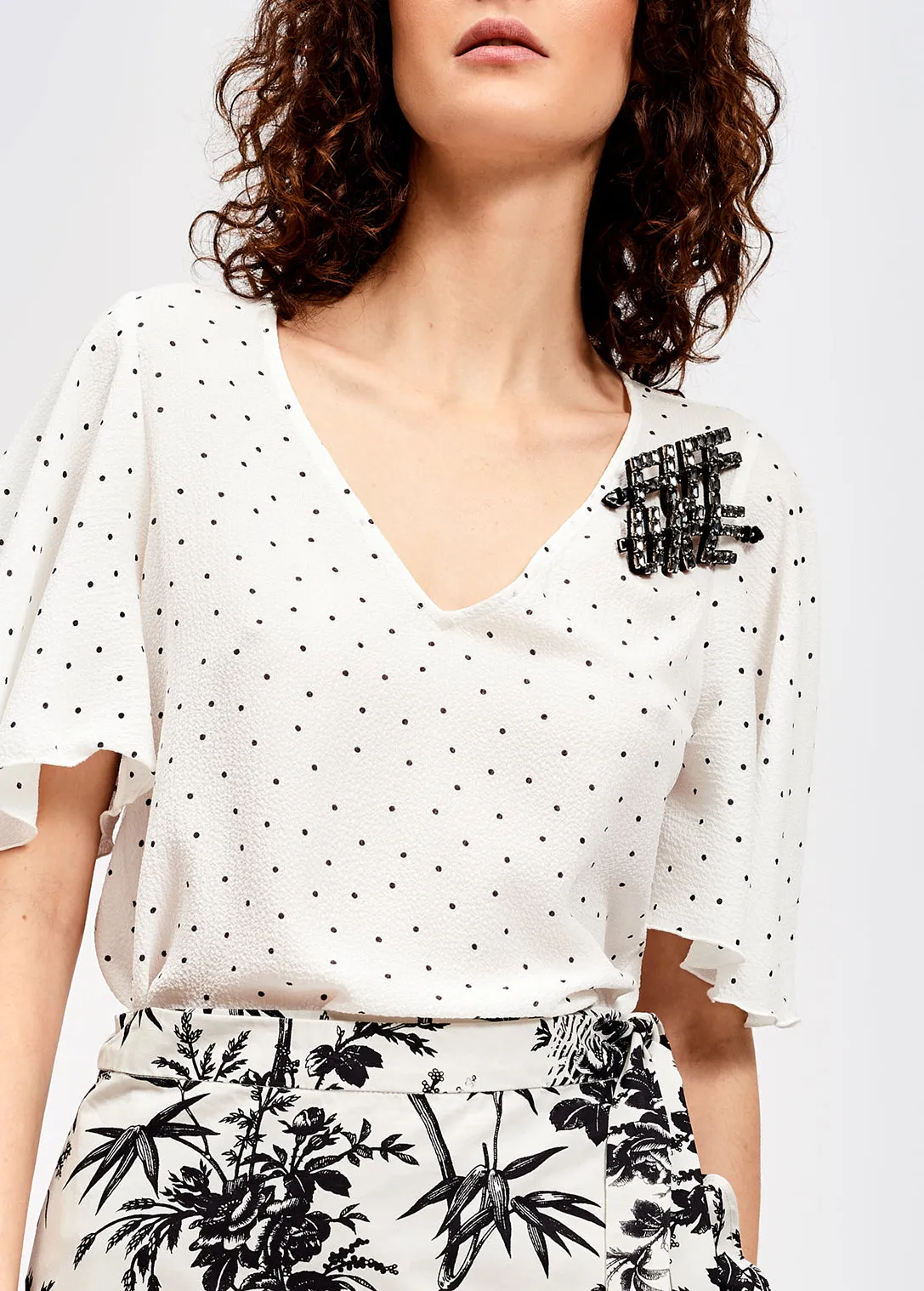 White polka dot v-neck top